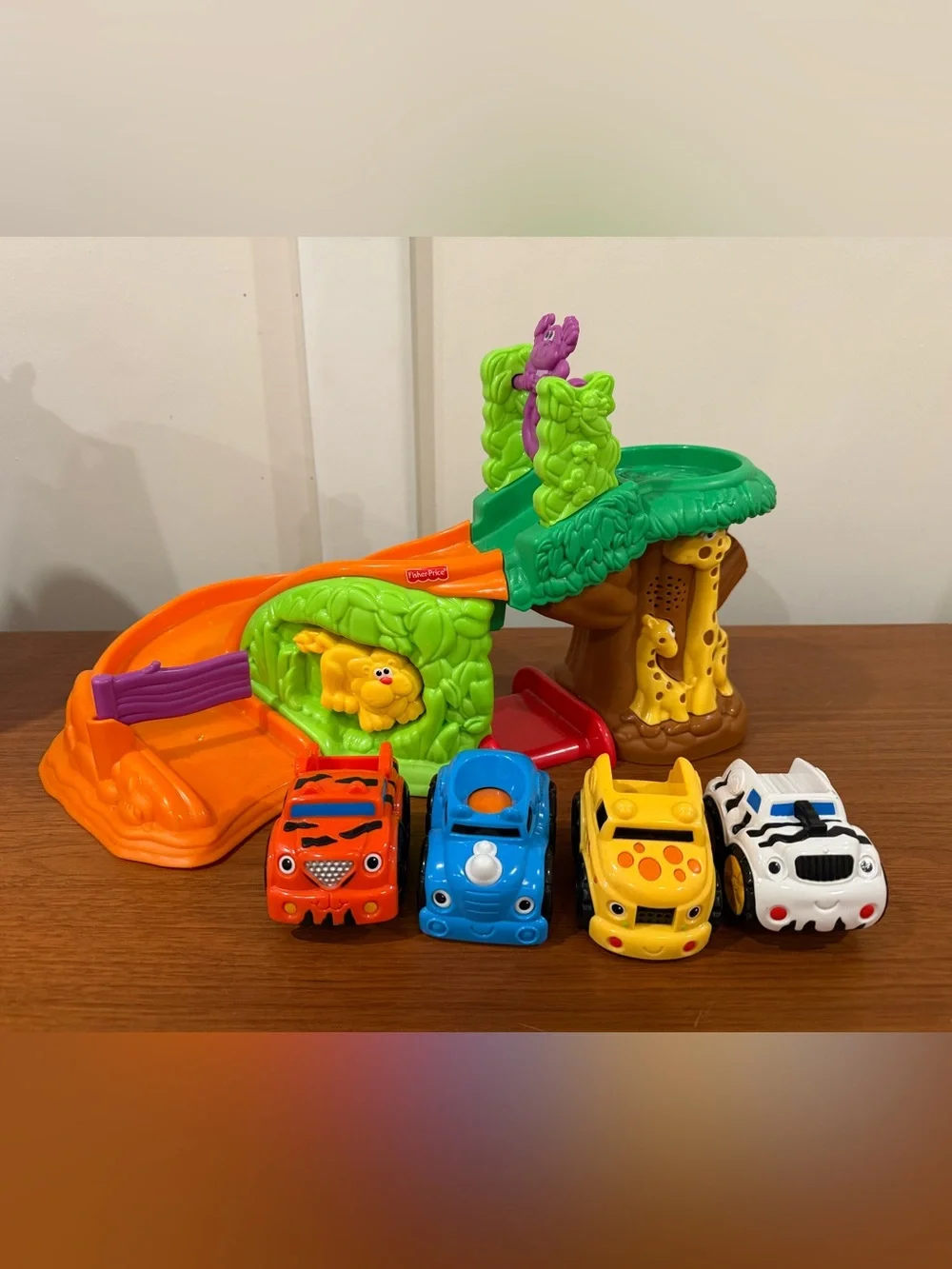 Fisher-Price Bright Green & Orange Jungle Slide Playset with Colorful Toy Cars